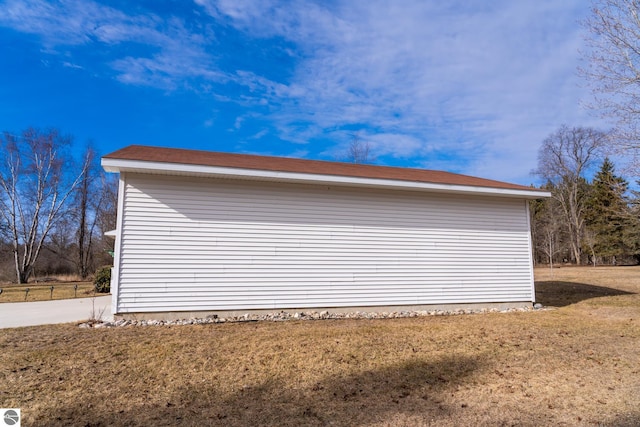 view of side of property featuring a yard