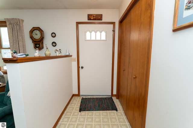 entryway featuring baseboards