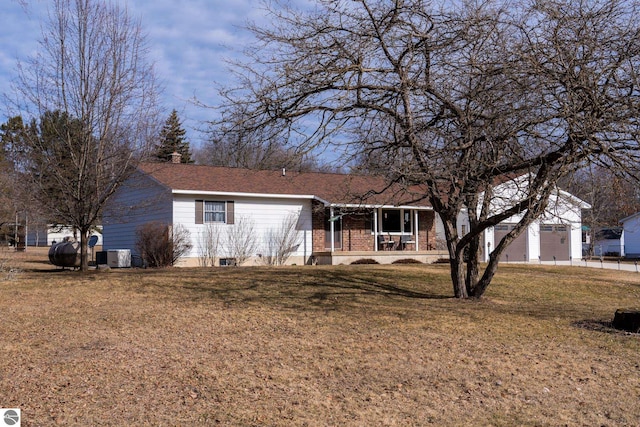 ranch-style house with a front lawn and a porch