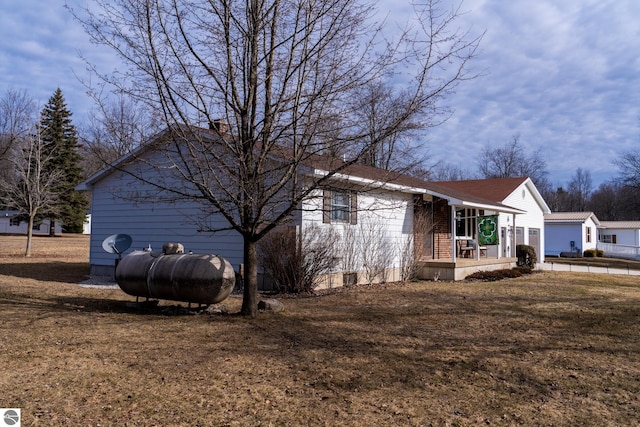 view of side of home featuring a yard