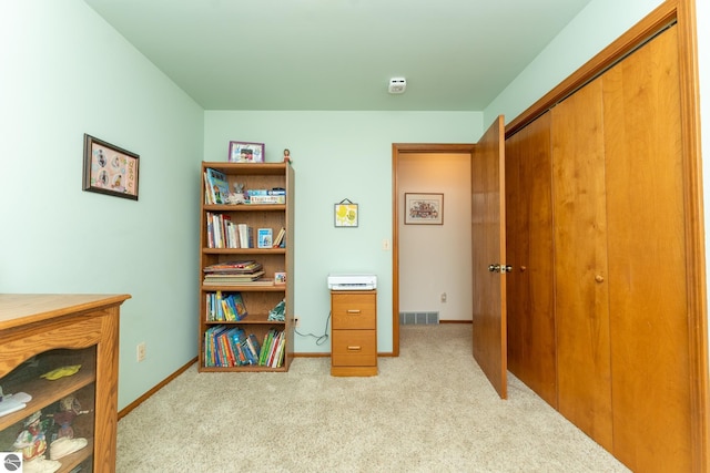 office featuring visible vents, baseboards, and carpet floors