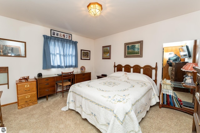 bedroom with light colored carpet