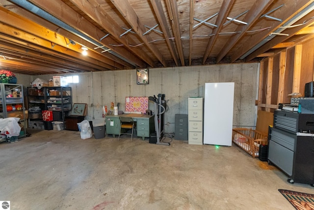 basement with freestanding refrigerator