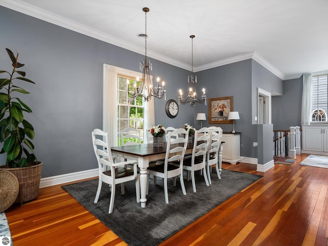 dining room with baseboards, plenty of natural light, and hardwood / wood-style floors