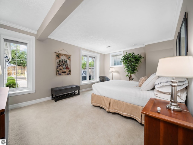 carpeted bedroom with baseboards and ornamental molding