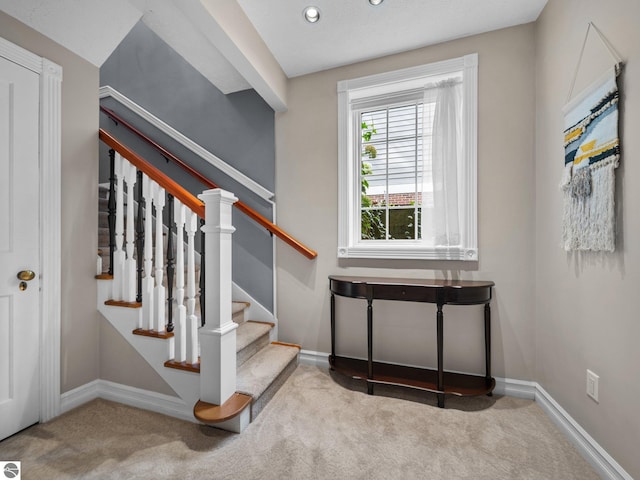 stairs featuring recessed lighting, baseboards, and carpet