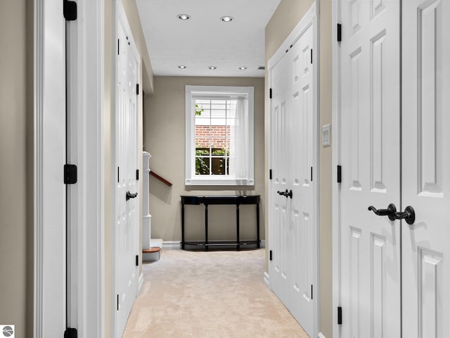 hallway featuring recessed lighting, baseboards, and carpet flooring