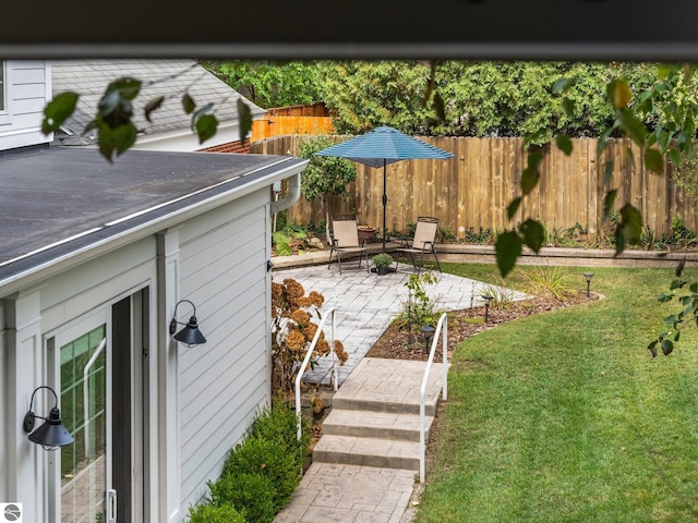 view of yard featuring a patio and fence