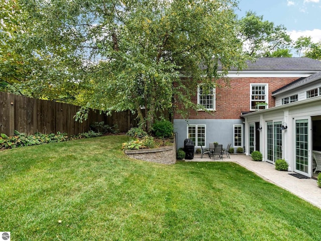 view of yard with a patio area and fence