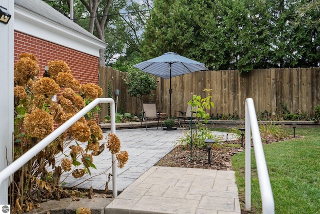 view of patio / terrace featuring fence