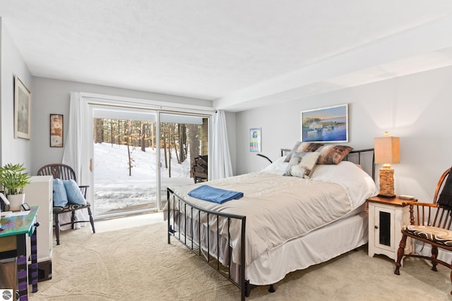 carpeted bedroom featuring access to exterior