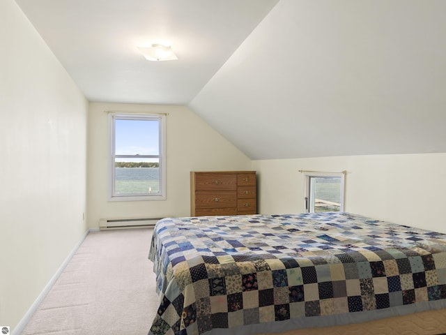 bedroom featuring baseboard heating, baseboards, carpet, and vaulted ceiling