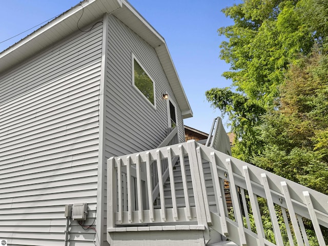 view of property exterior featuring stairs