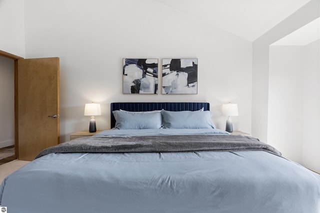 bedroom with lofted ceiling