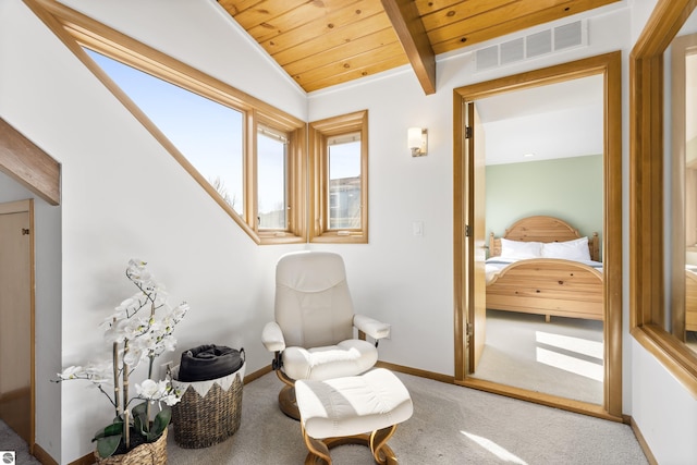 living area featuring carpet, visible vents, baseboards, lofted ceiling with beams, and wooden ceiling