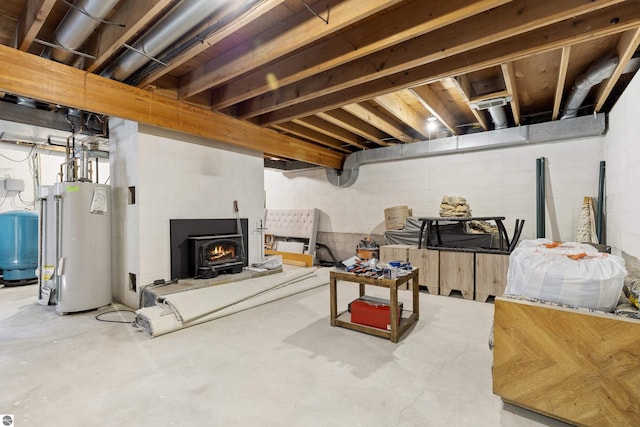 unfinished basement featuring water heater