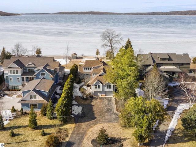 bird's eye view with a residential view and a water view