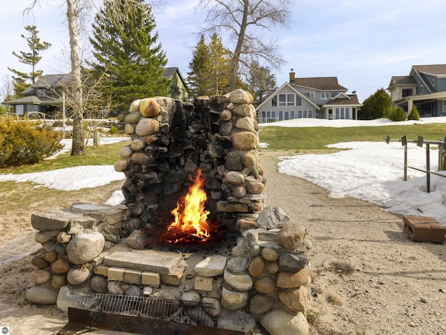 view of yard with an outdoor stone fireplace