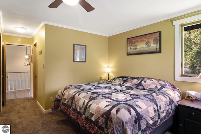 bedroom featuring ornamental molding, a ceiling fan, baseboards, and carpet floors