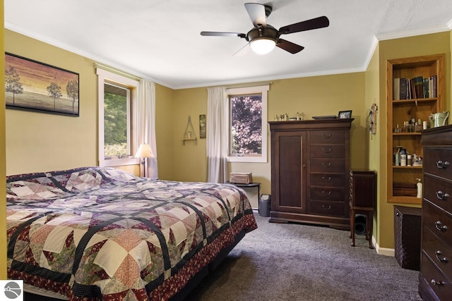 carpeted bedroom featuring baseboards, a ceiling fan, and crown molding