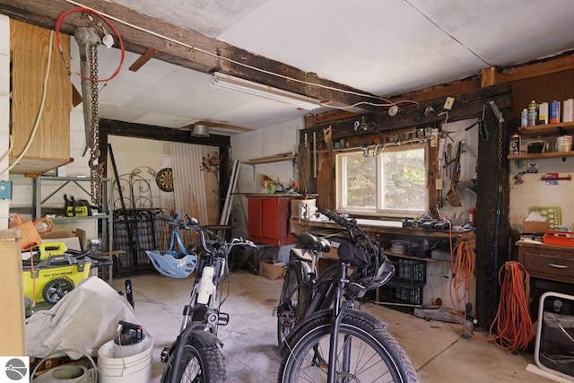 miscellaneous room with a workshop area and concrete floors