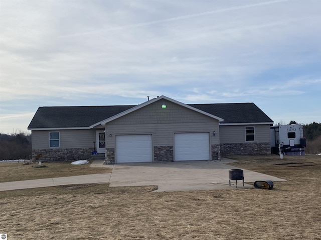 single story home featuring stone siding, an attached garage, a shingled roof, and driveway