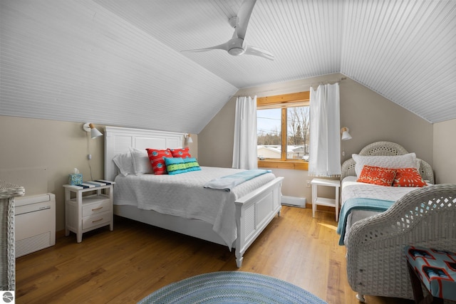 bedroom featuring lofted ceiling, ceiling fan, and light wood finished floors