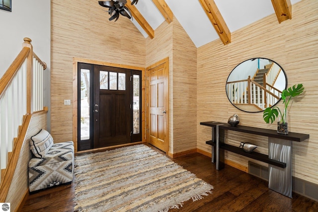 foyer featuring visible vents, beam ceiling, high vaulted ceiling, wood finished floors, and ceiling fan