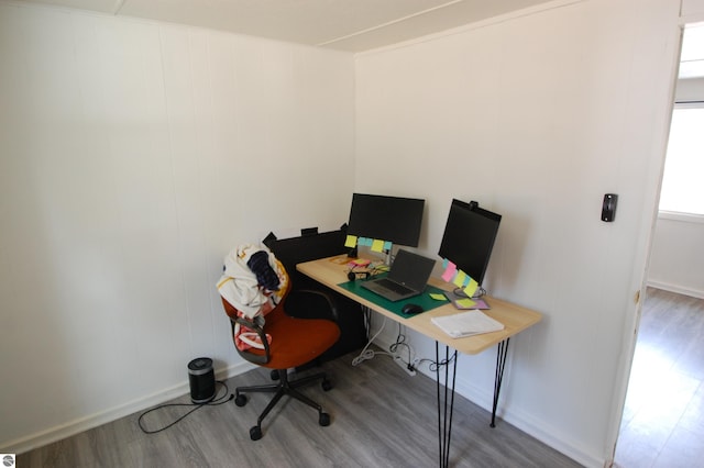 office area featuring baseboards and wood finished floors