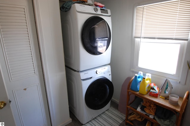 laundry room featuring laundry area and stacked washing maching and dryer