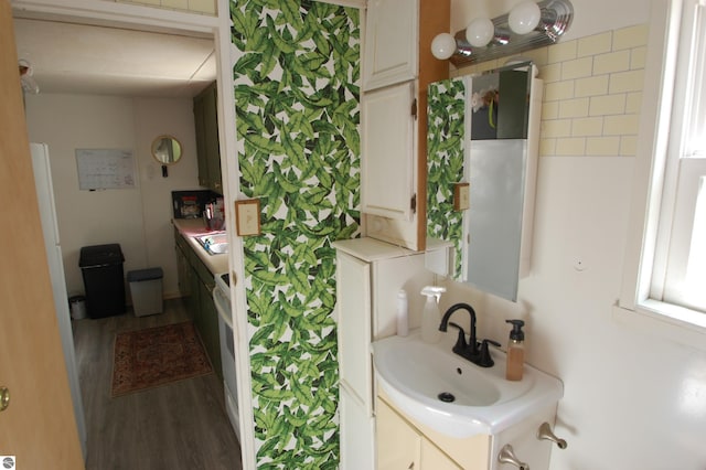 bathroom with vanity and wood finished floors