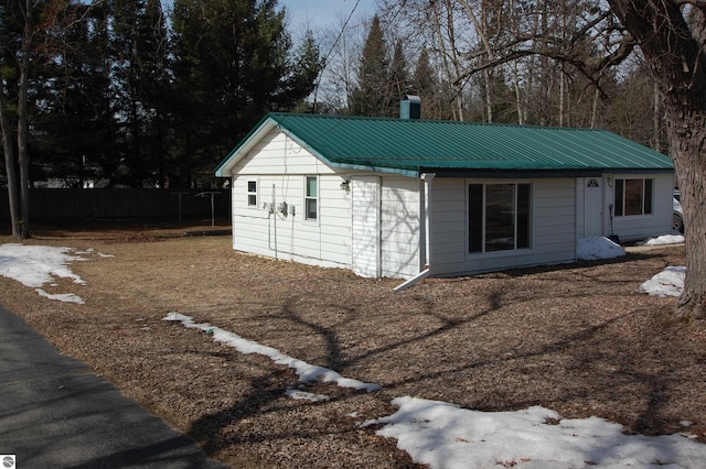 view of outdoor structure with fence