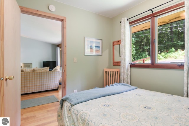 bedroom featuring wood finished floors