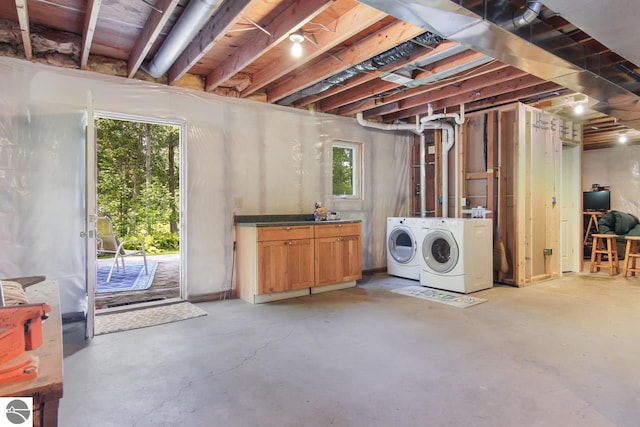 basement with plenty of natural light and washing machine and clothes dryer