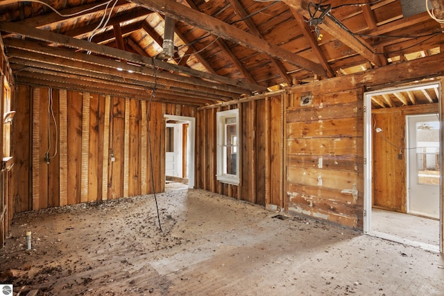 miscellaneous room with lofted ceiling