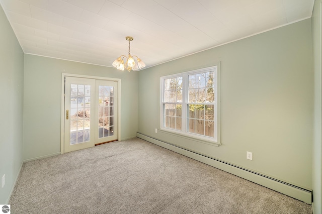 carpeted empty room with a baseboard radiator, a healthy amount of sunlight, ornamental molding, and an inviting chandelier