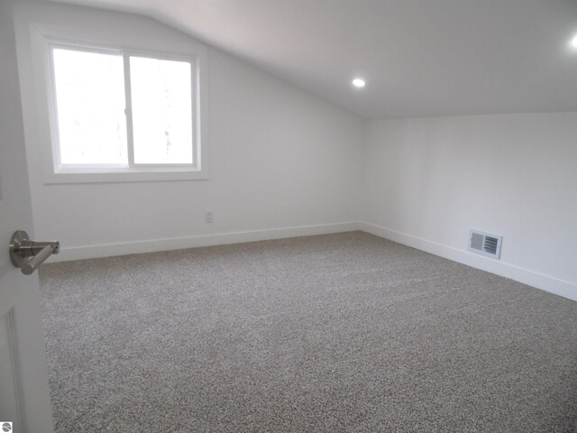 4177 Seminole St, Gladwin, MI 48624 - additional living space featuring vaulted ceiling, carpet floors, baseboards, and recessed lighting