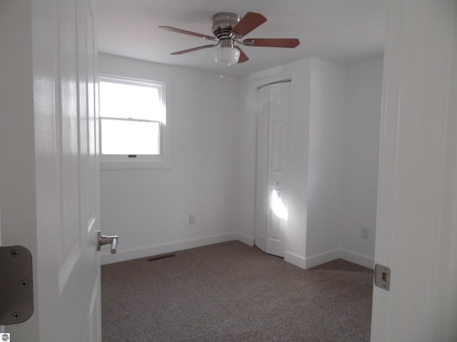 4177 Seminole St, Gladwin, MI 48624 - empty room with ceiling fan, carpet, and baseboards