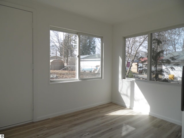 4177 Seminole St, Gladwin, MI 48624 - unfurnished room with wood finished floors and baseboards