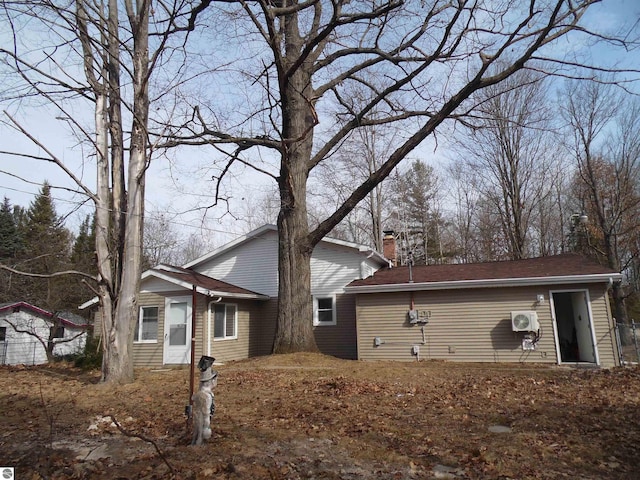 4177 Seminole St, Gladwin, MI 48624 - view of side of home featuring a chimney and ac unit