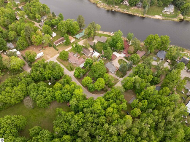 4177 Seminole St, Gladwin, MI 48624 - aerial perspective of suburban area featuring a large body of water and a tree filled landscape