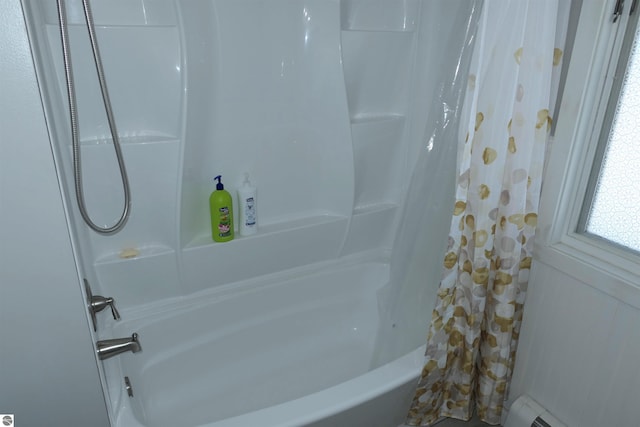 5661 Golfridge Rd, Alma, MI 48801 - full bath with a baseboard radiator and shower / bathtub combination with curtain