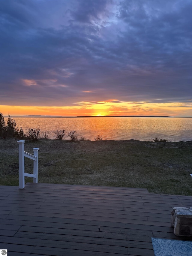 4781 E Golfview Dr, Leland, MI 49654 - deck at dusk with a water view