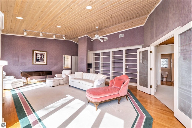 living room with track lighting, a ceiling fan, wood finished floors, wooden ceiling, and lofted ceiling