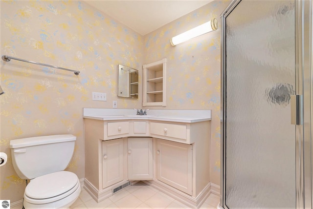 bathroom with toilet, a stall shower, vanity, and wallpapered walls