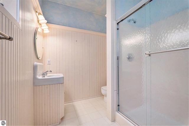 full bath featuring toilet, a stall shower, vanity, and tile patterned flooring