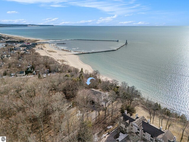aerial view with a water view and a beach view