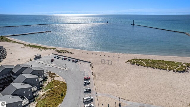 birds eye view of property featuring a view of the beach and a water view