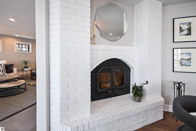 5568 Lakeview Dr, Interlochen, MI 49643 - detailed view of wood finished floors, recessed lighting, a fireplace, and baseboards