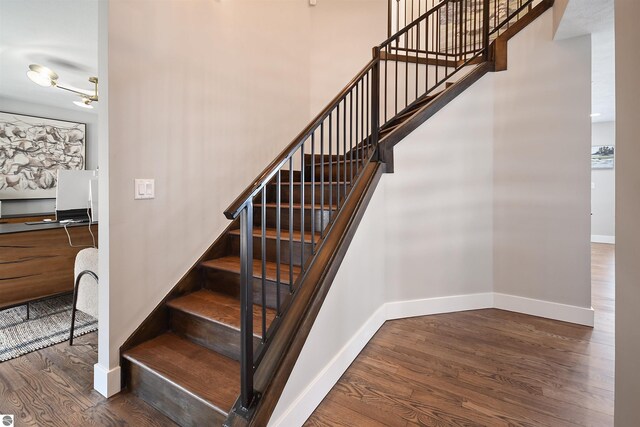 5568 Lakeview Dr, Interlochen, MI 49643 - stairs with wood finished floors and baseboards